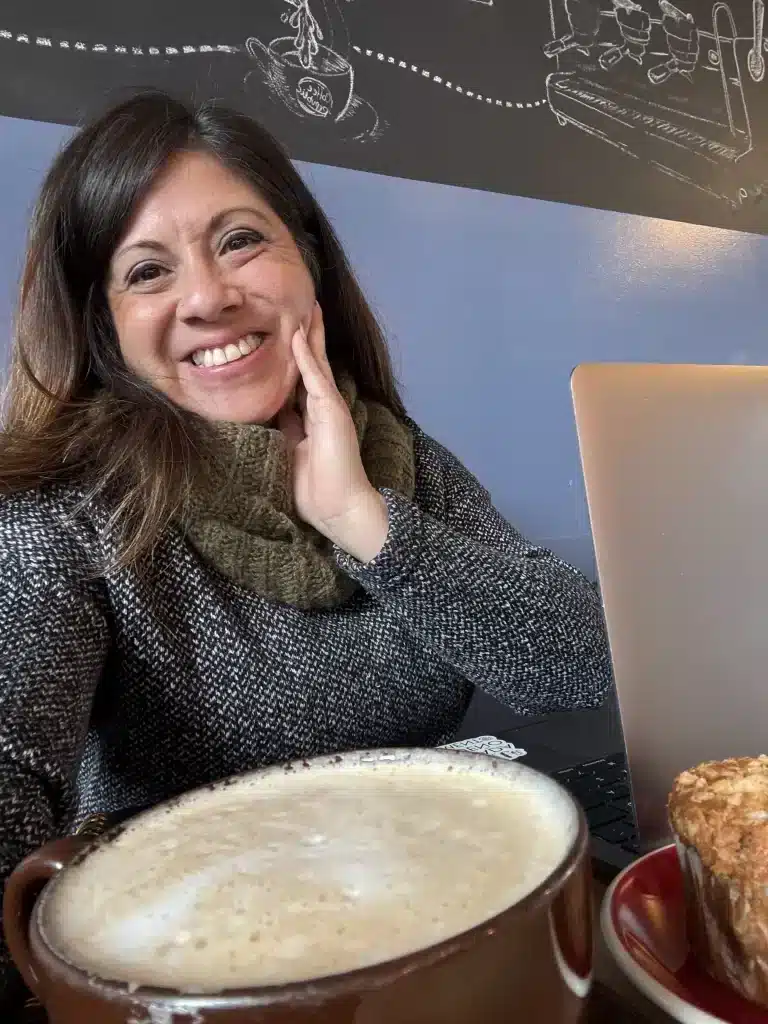 Wendie Veloz Social Impact Strategist enjoys a chai tea while working in Rockville, MD